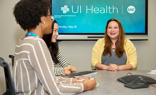 Women sitting in a UI Health conference room