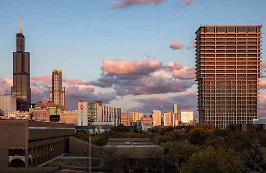 photo of UIC campus in foreground with Willis Tower and other skyscrapers in background
