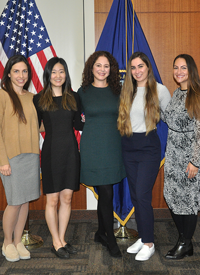 Jesse Brown VA Pharmacists pose in front of US flag