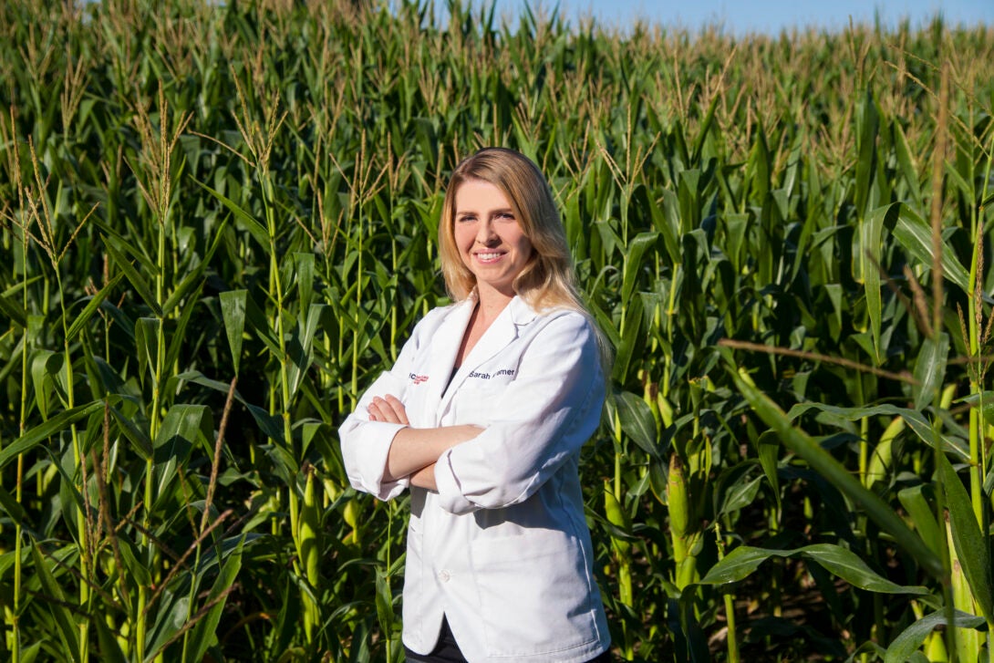 Pharmacy student standing in a cornfield