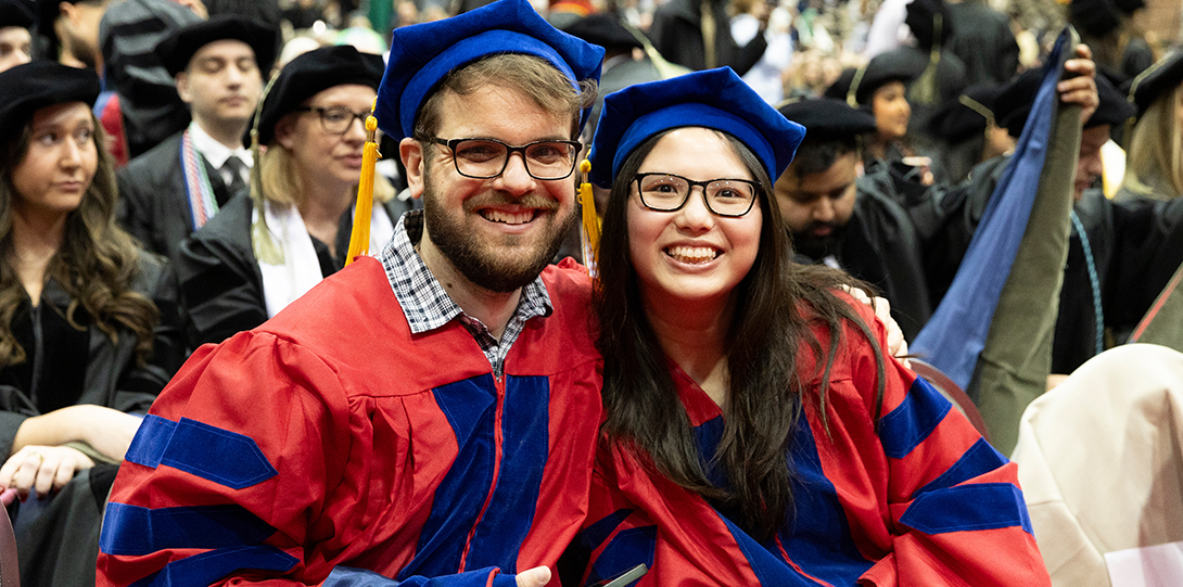 PhD graduates seated in Dorin Forum