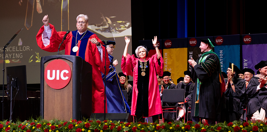 Dean Schumock, Chancellor Miranda, and Dr. Barish dance on stage at 2025 Commencement