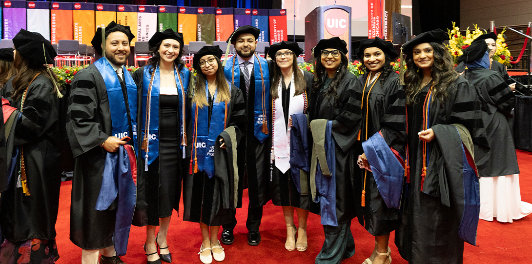 Graduates from the Urban Health Program pose together in Dorin Forum